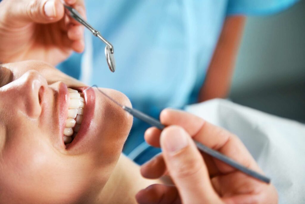 Smiling patient getting a routine cleaning