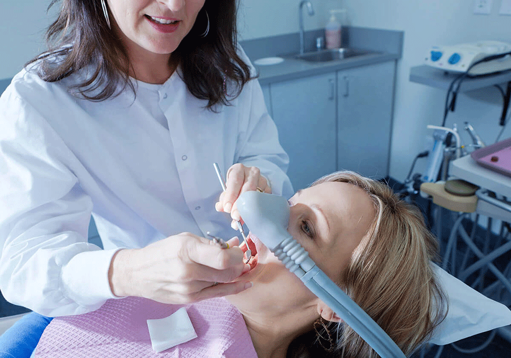 Dentist using sedation during treatment