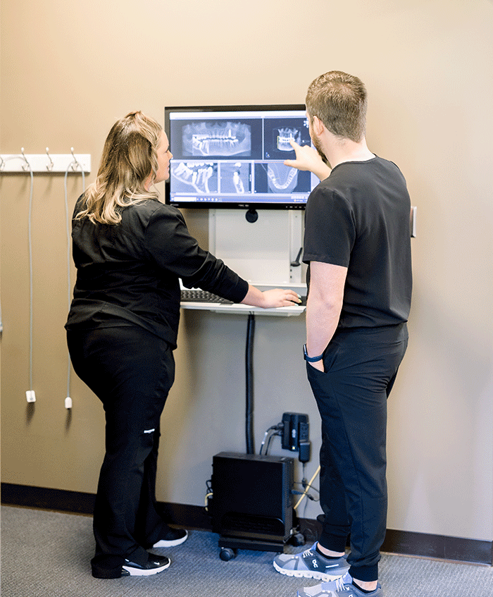 Dr. Zach and Tracy looking at X-rays